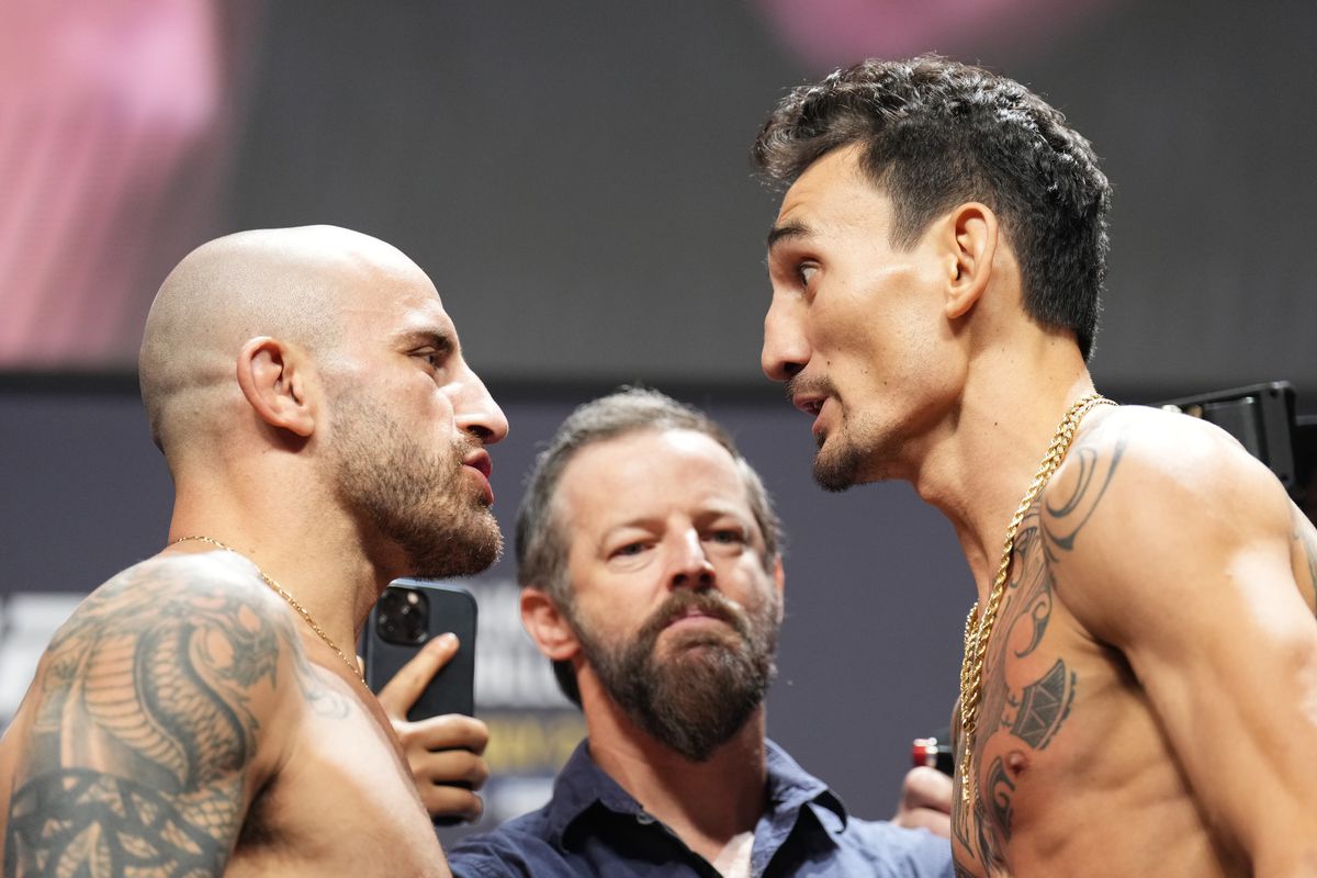 Opponents Alexander Volkanovski of Australia and Max Holloway face off during the UFC 276 ceremonial weigh-in at T-Mobile Arena on July 01, 2022 in Las Vegas, Nevada.