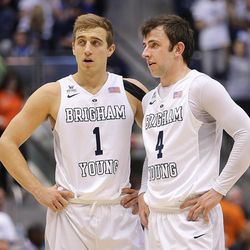 Brigham Young Cougars guard Chase Fischer (1) and teammate Brigham Young Cougars guard Nick Emery (4) talk at mid-court as BYU and Creighton play in NIT quarterfinal action at the Marriott Center in Provo Tuesday, March 22, 2016.
