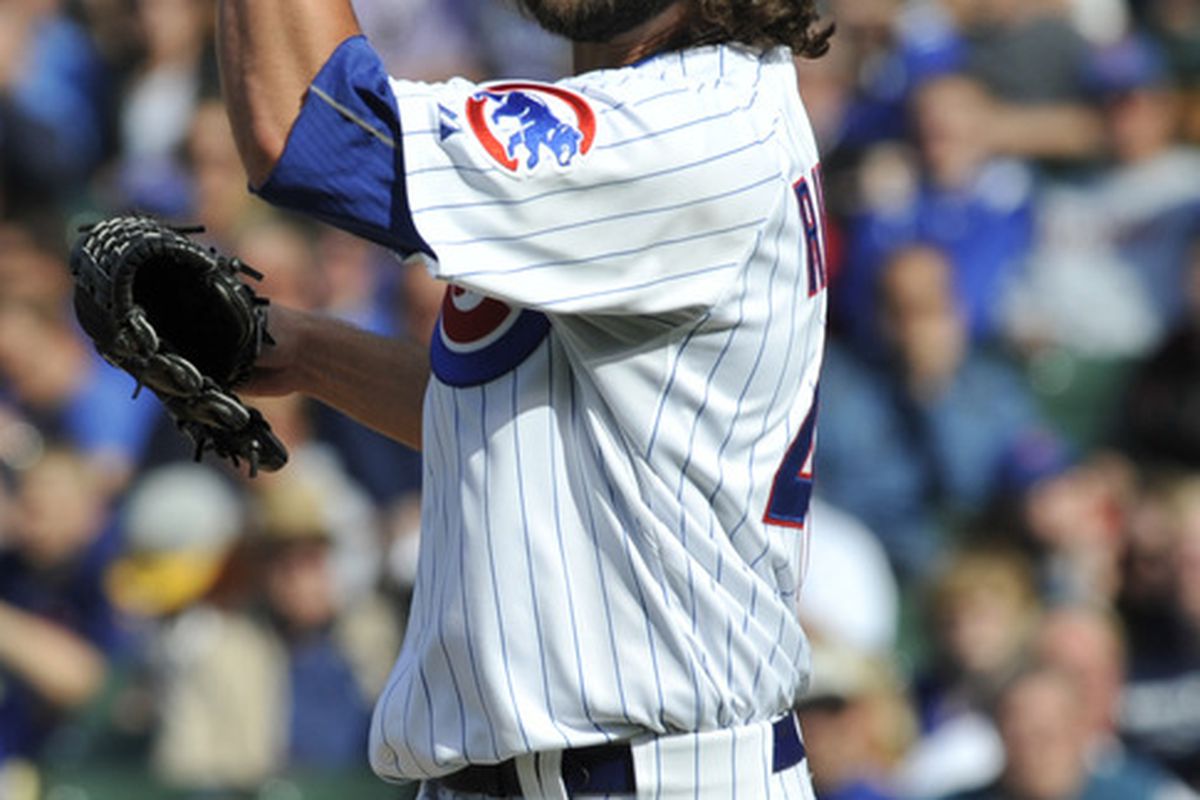 James Russell of the Chicago Cubs celebrates after striking out a San Diego Padres hitter at Wrigley Field in Chicago, Illinois. The Chicago Cubs defeated the San Diego Padres 8-6.  (Photo by David Banks/Getty Images)