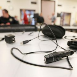 A body camera lays on a table as West Valley police officers receive new cameras and and are instructed on their use on Wednesday, Feb. 25, 2015.
