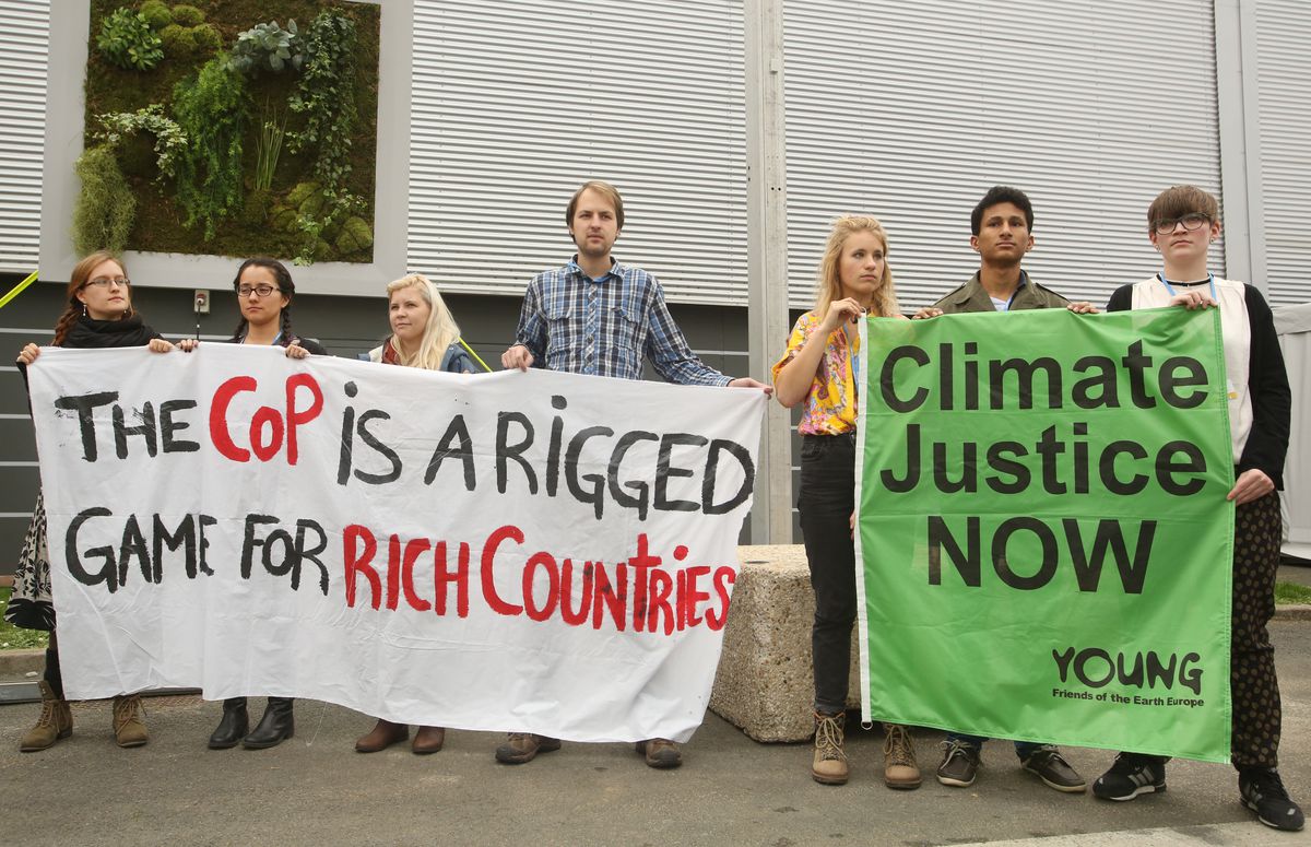 Protestors demonstrate against COP21 at Le Bourget on December 1, 2015 in Paris, France. The COP21 summit will see negotiators from 195 country try to finalise a new climate treaty over the next two weeks. REDD and Indigenous Leaders said that this United