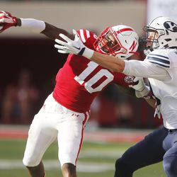 Brigham Young Cougars wide receiver Mitch Mathews (10) has the ball deflected byNebraska Cornhuskers defensive back Joshua Kalu (10) against Nebraska in Lincoln, Neb., Saturday, Sept. 5, 2015. BYU won 33-28 on a last-second touchdown pass.