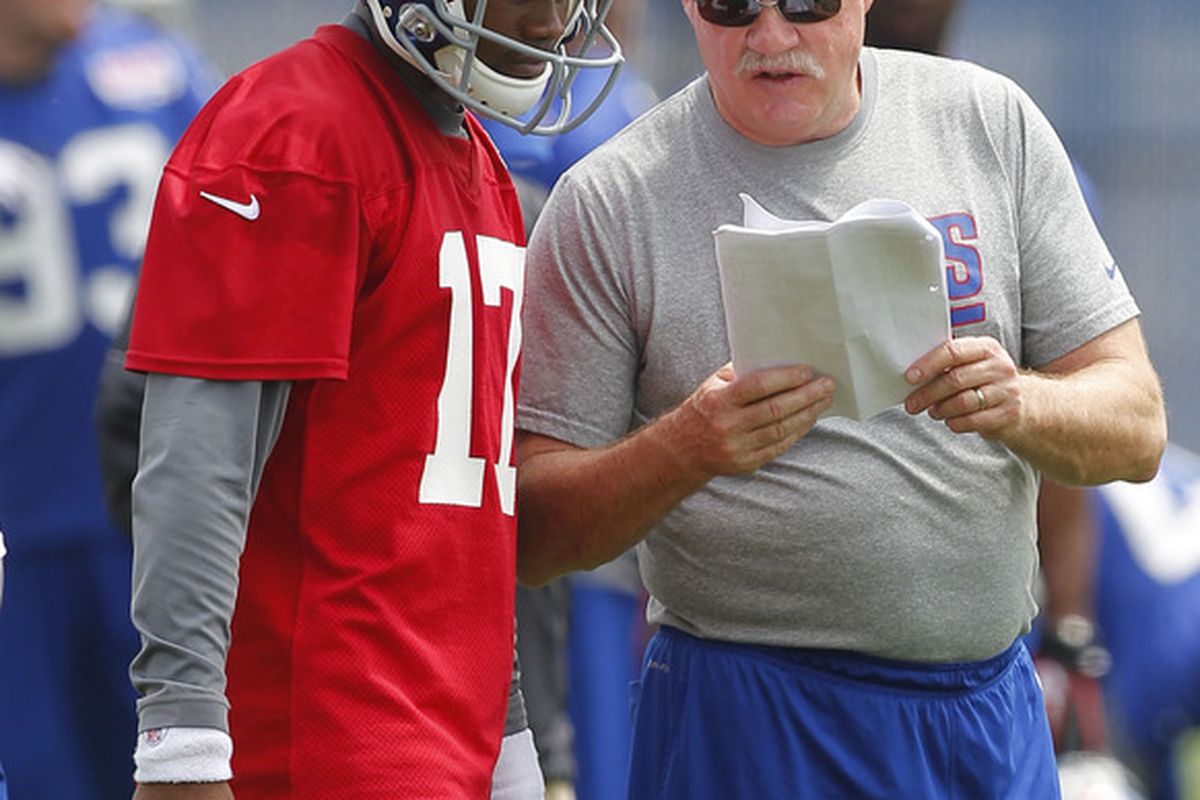 May 23, 2012; East Rutherford, NJ, USA;  New York Giants offensive coordinator Kevin Gilbride talks to quarterback Ryan Perrilloux (17) during the Giants OTA at the their training facility. Jim O'Connor-US PRESSWIRE