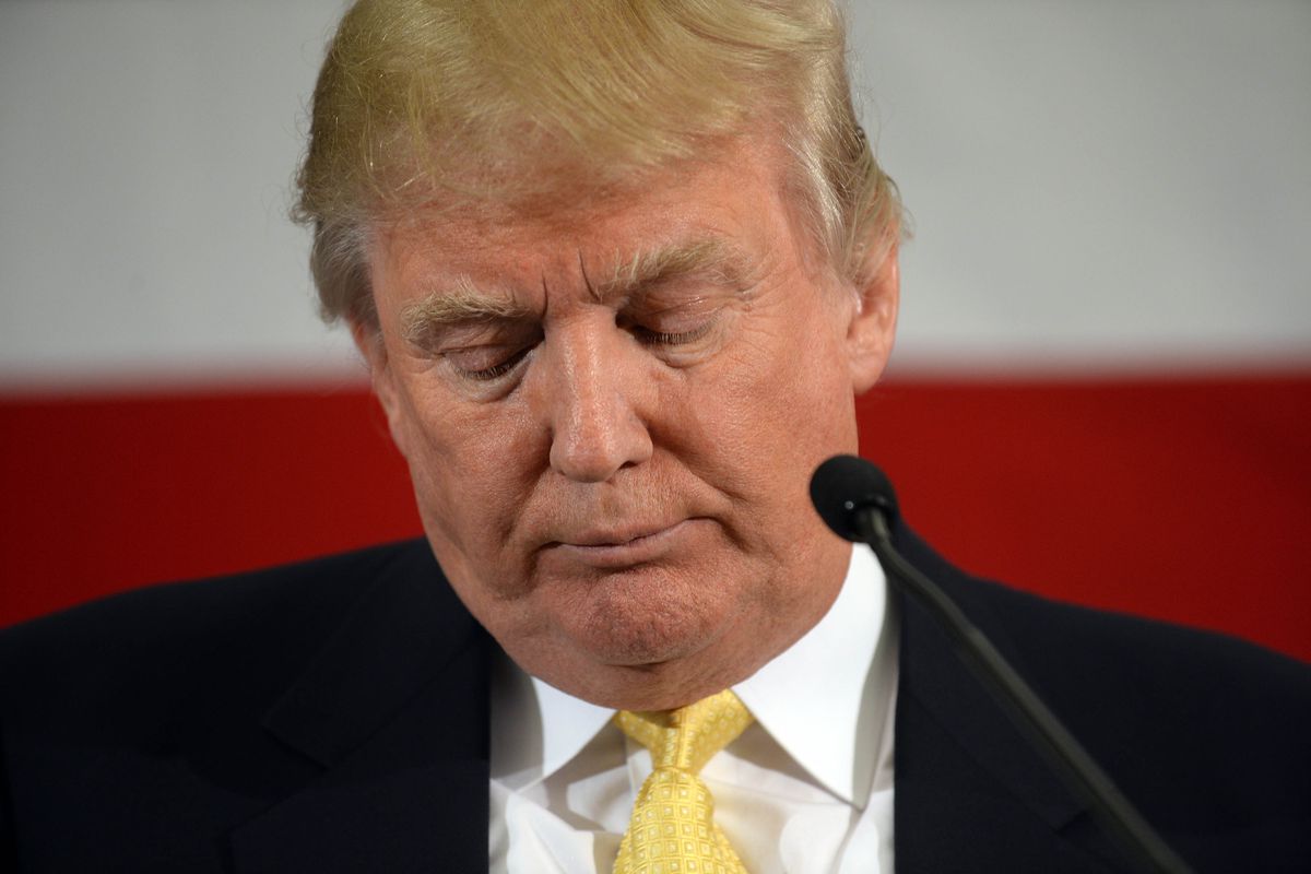 Donald Trump eyes downcast, looking sad