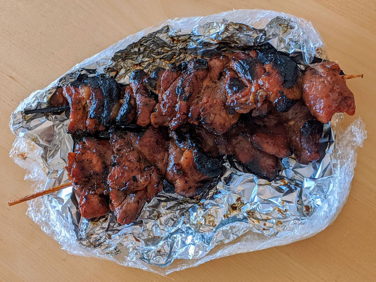 Pork skewers wrapped in foil from Fil-Am Cuisine