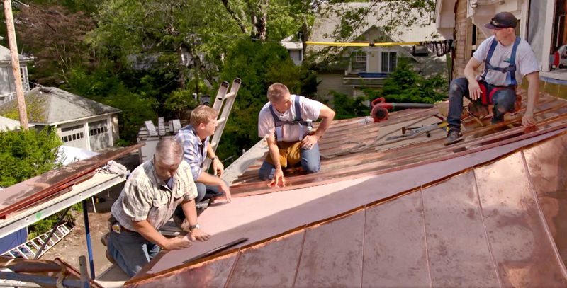 Tom Silva and Kevin O’Connor get an up-close look at the standing-seam portico roof installation, July/Aug 2020