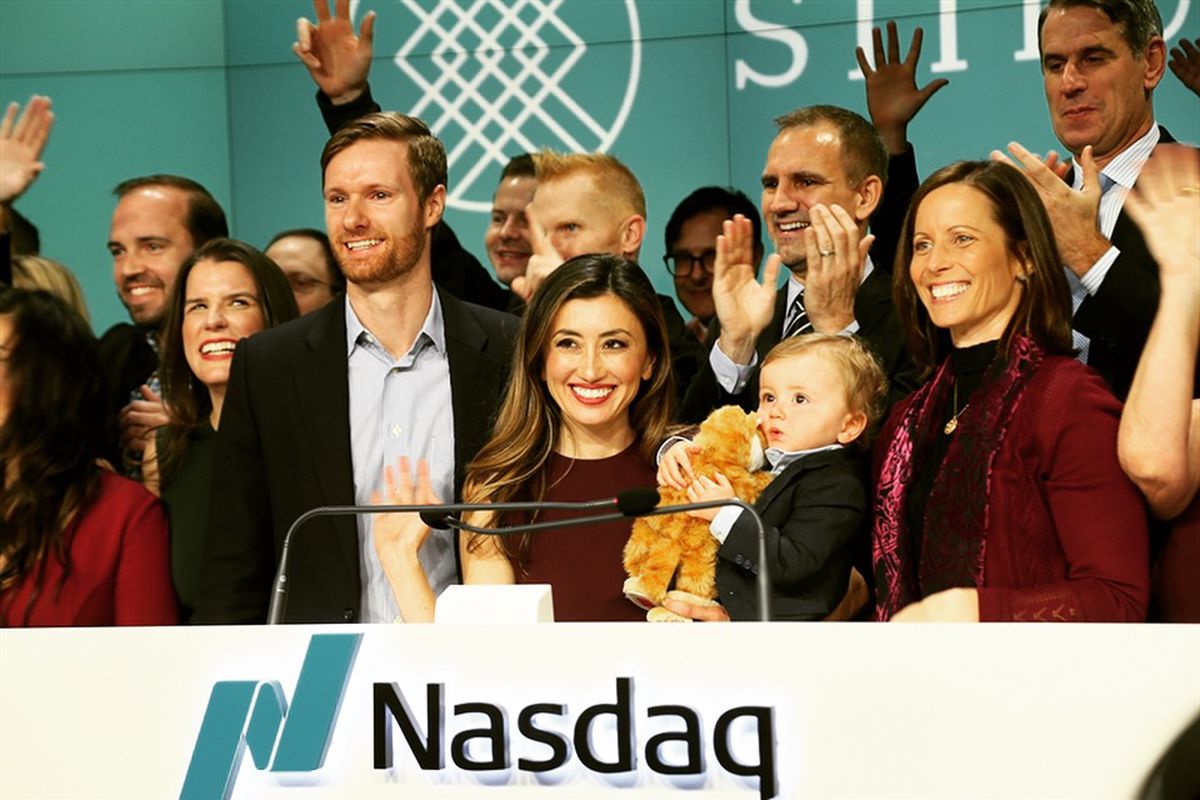 A group of people from Stitch Fix —&nbsp;including founder and CEO Katrina Lake holding her young son — ring the bell at the Nasdaq stock exchange at the company’s IPO.
