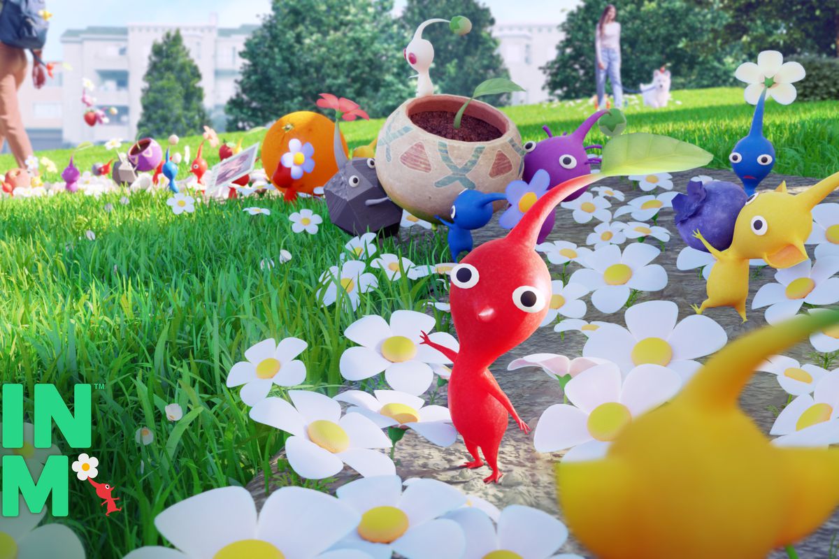 a bunch of pikmin stand on a sidewalk filled with flowers. there’s title text that reads: Pikmin Bloom