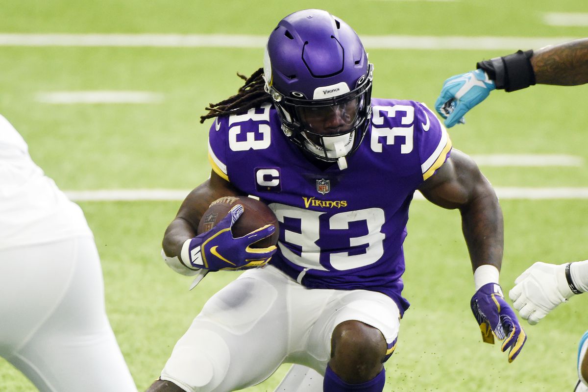 Dalvin Cook #33 of the Minnesota Vikings runs with the ball during the first half against the Carolina Panthers at U.S. Bank Stadium on November 29, 2020 in Minneapolis, Minnesota.