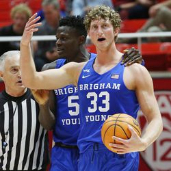 Brigham Young Cougars forward Caleb Lohner (33) is upset after being fouled at the end of the game by Utah in Salt Lake City on Saturday, Nov. 27, 2021. BYU won 75-64.
