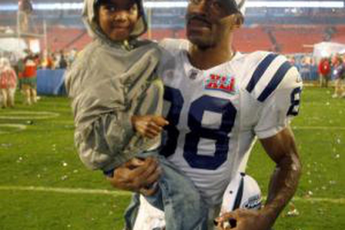 Marvin Harrison with his son after wining Super Bowl 41. Image: <a href="http://photos.upi.com/story/t/bcaa281fafe111bc9a611a4cbdb5d67f/Report-Colts-to-dump-Marvin-Harrison.jpg">photos.upi.com</a>