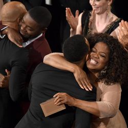 David Oyelowo, second from left, and Oprah Winfrey, right, congratulate Common, left, and John Legend, second from right, after they won the award for best original song in a feature film for “Glory” from “Selma" at the Oscars on Sunday, Feb. 22, 2015, at the Dolby Theatre in Los Angeles. 