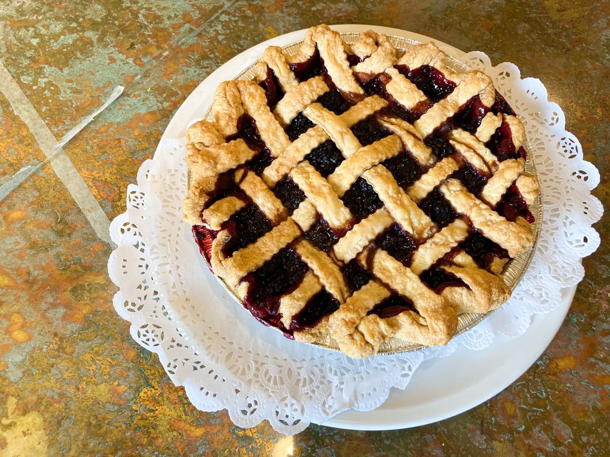A lattice-topped marionberry pie sits on a tile counter of Metropol Bakery in Eugene, Oregon.
