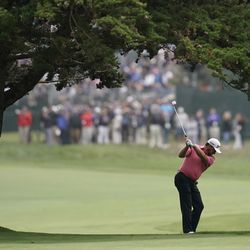 Graeme McDowell, of Northern Ireland, hits from the fairway on the 18th hole during the second round of the U.S. Open Championship golf tournament Friday, June 14, 2019, in Pebble Beach, Calif. (AP Photo/David J. Phillip)