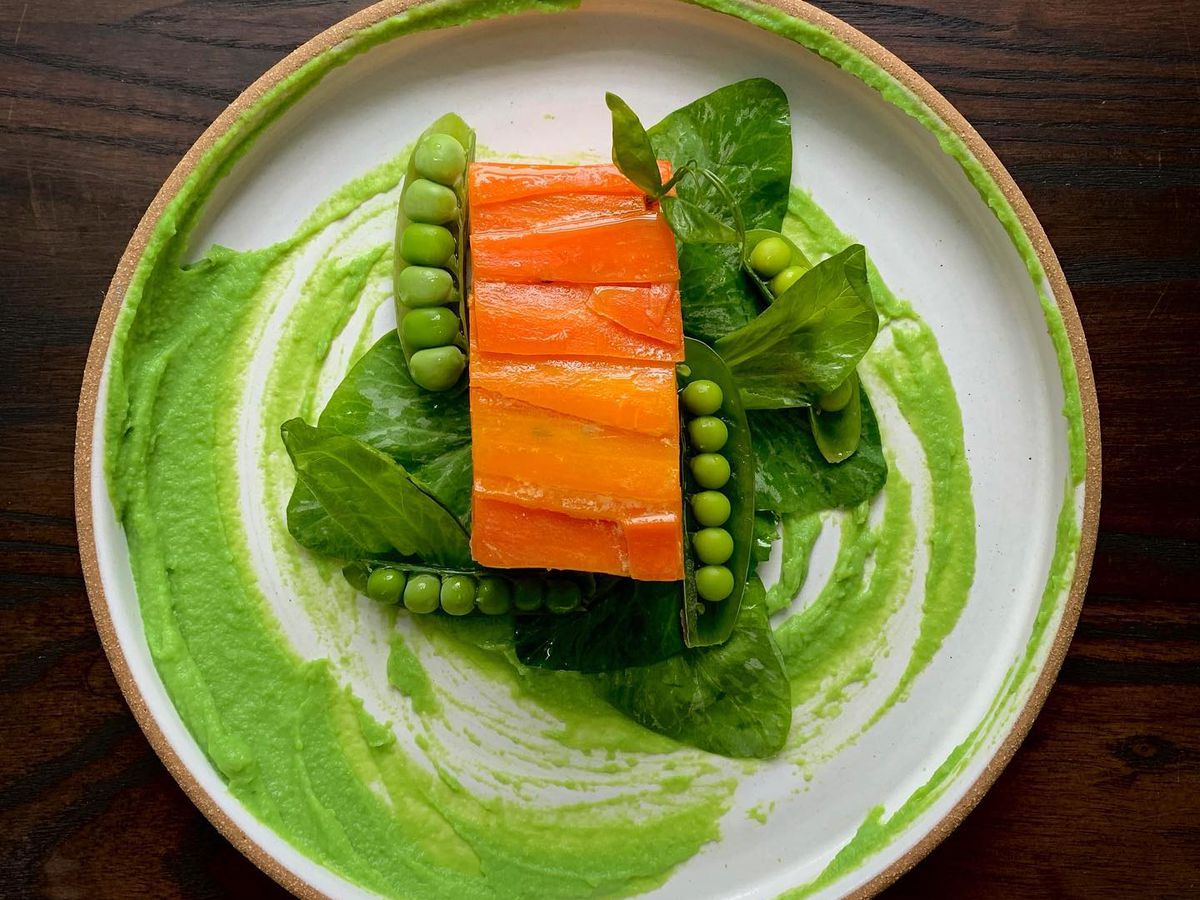 A carrot terrine with pea leaves, grilled pea shell,  and whey puree from the Oro pop-up