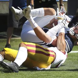 Brigham Young Cougars wide receiver Dax Milne (82) catches a touchdown over USC Trojans cornerback Chase Williams (7) in Provo on Saturday, Sept. 14, 2019.