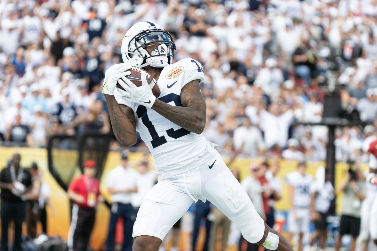 Penn State Nittany Lions wide receiver KeAndre Lambert-Smith (13) catches a pass for a touchdown during the first half against the Arkansas Razorbacks during the 2022 Outback Bowl at Raymond James Stadium.&nbsp;