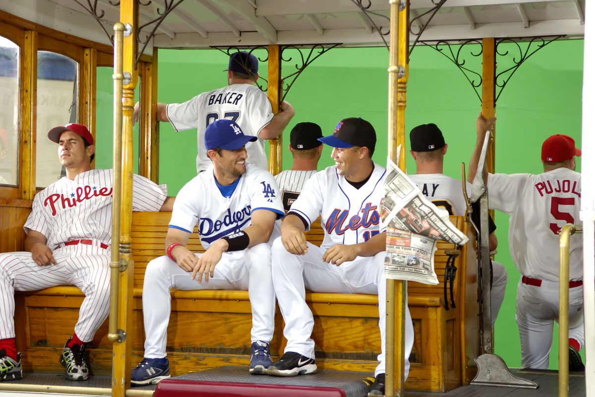 New York Mets’ Carlos Beltran (right) smiles as he faces Los