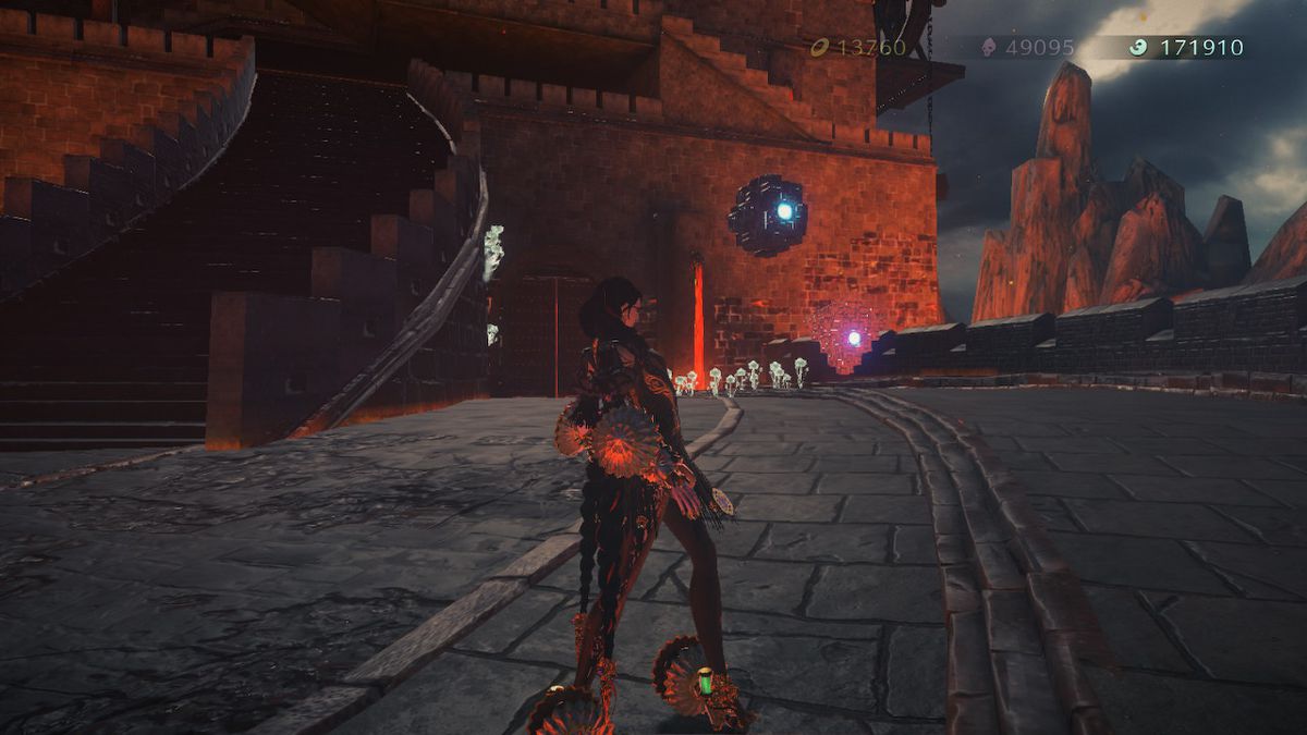Bayonetta stands near a giant demon in Bayonetta 3.