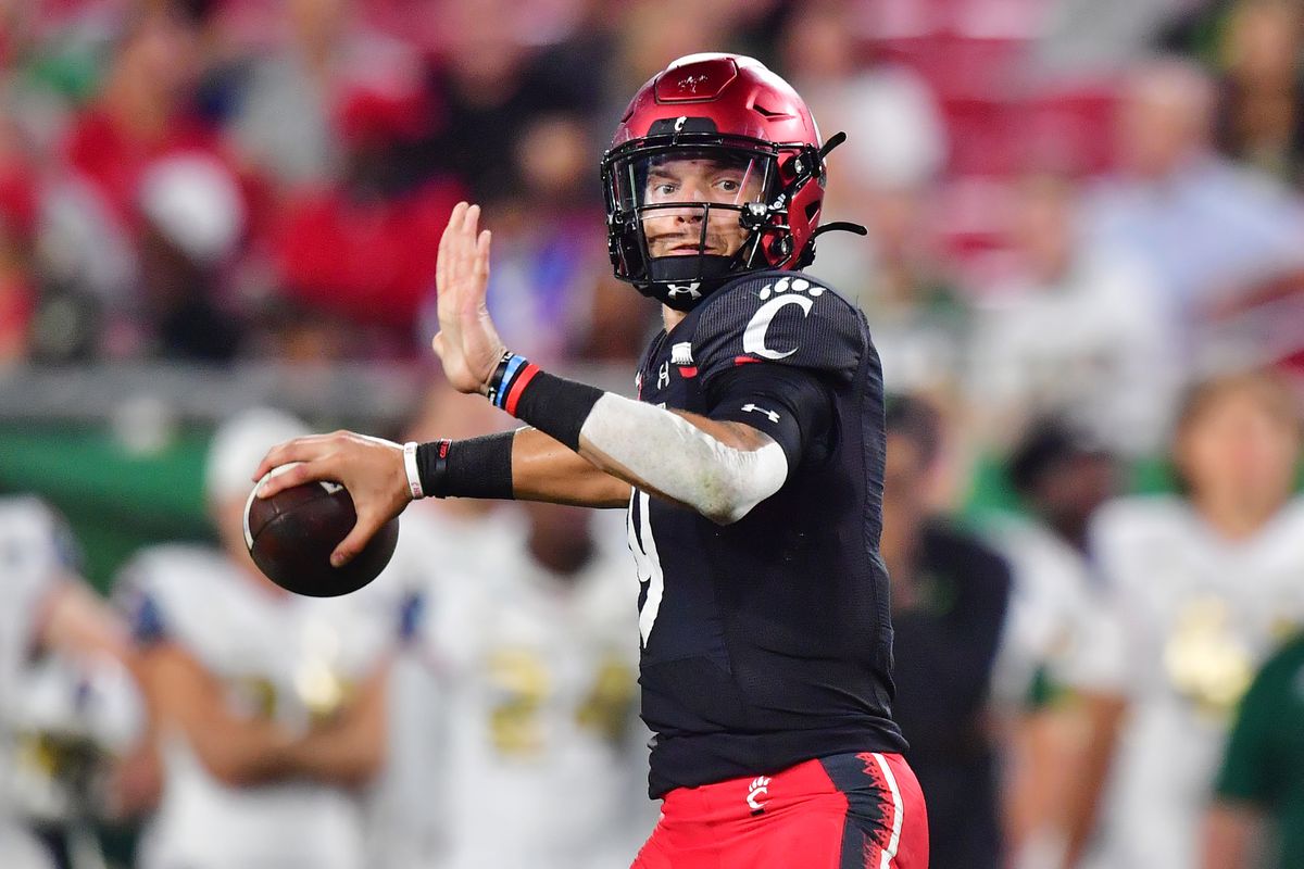 Desmond Ridder of the Cincinnati Bearcats looks to throw a pass during the second quarter against the South Florida Bulls at Raymond James Stadium on November 12, 2021 in Tampa, Florida.