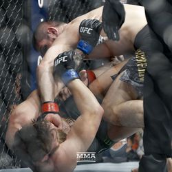 Khabib Nurmagomedov delivers a punch to Conor McGregor