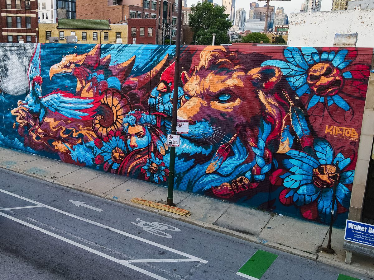 Matt Dean’s side of the mural at 488 N. Milwaukee Ave. blends his love for comics — the lion, eagle and Pegasus — with nods to the Illinois state bird (the cardinal) and insect (the monarch butterfly).