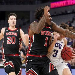 Utah’s Lazar Stefanovic (20) looks on as David Jenkins Jr. (1) fouls TCU’s Francisco Farabello (3) on a drive to the basket in the first half of an NCAA college basketball game in Fort Worth, Texas, Wednesday, Dec. 8, 2021. A technical foul was issued on the play. 