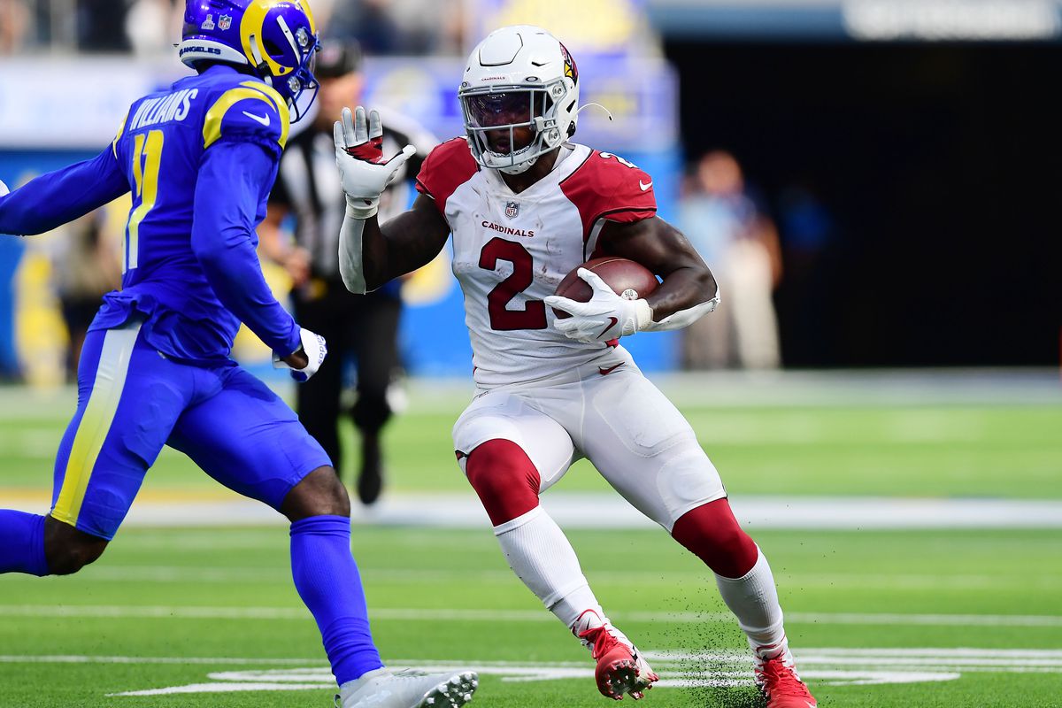 Arizona Cardinals running back Chase Edmonds (2) runs the ball against Los Angeles Rams defensive back Darious Williams (11) during the second half at SoFi Stadium.