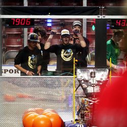 Abdul Ayubi celebrates at the end of a competition as students from Cottonwood High School work to compete in the First Robotics Competition Utah Regional event at the Maverik Center in West Valley City, Utah, on Friday, March 29, 2019.