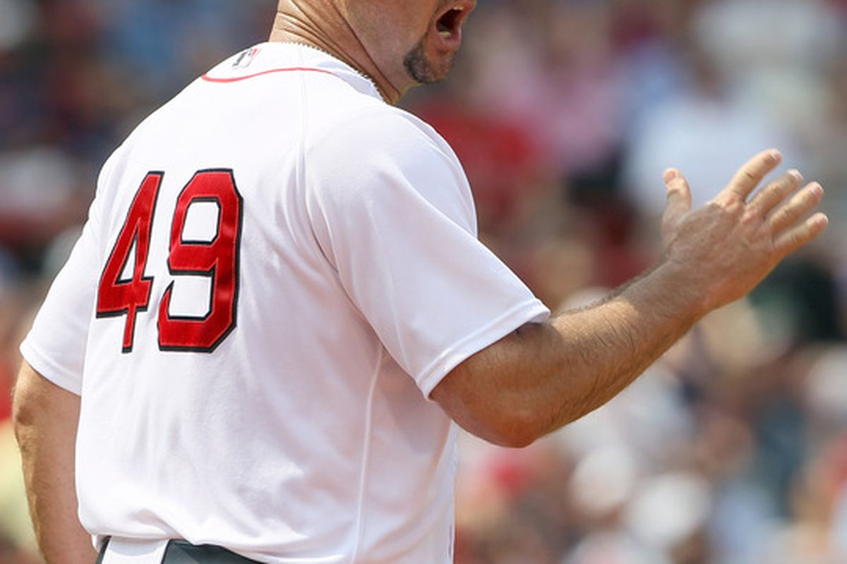 BOSTON, MA - JUNE 01:  Tim Wakefield #49 of the Boston Red Sox reacts after Juan Pierre of the Chicago White Sox is called safe after a rundown on June 1, 2011 at Fenway Park in Boston, Massachusetts.  (Photo by Elsa/Getty Images)