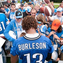 Jul 27, 2013; Allen Park, MI, USA; Detroit Lions wide receiver Nate Burleson (13) signs autographs after training camp at the Detroit Lions training facility.