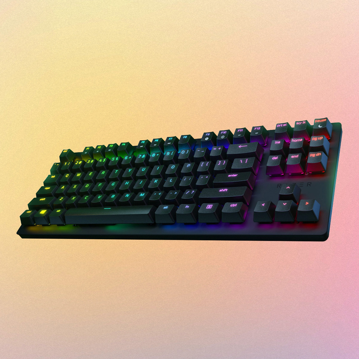 The Razer Huntsman Tournament Edition keyboard on a rainbow background. 