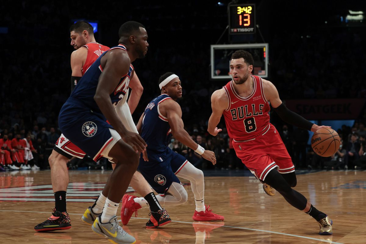 Chicago Bulls guard Zach LaVine (8) drives to the basket as Brooklyn Nets forward Paul Millsap (31) and forward Bruce Brown (1) defend during the first half at Barclays Center.
