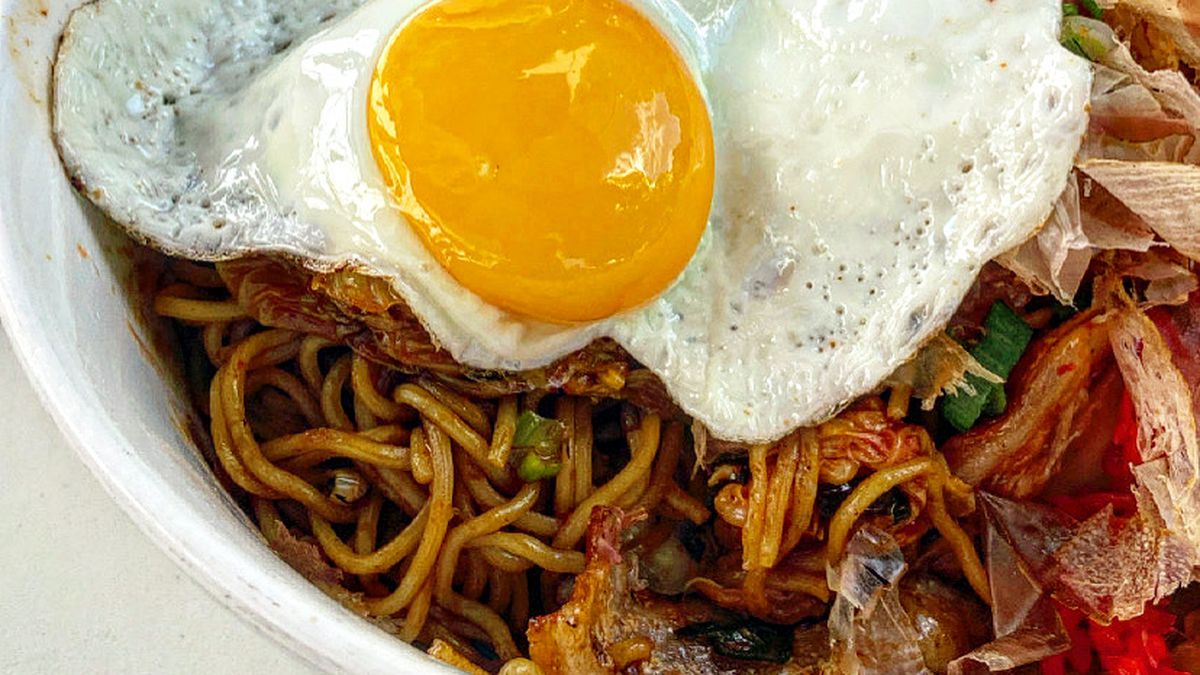 A bowl of yakisoba, which I often top with pork belly, spicy kimchi, and a sunny egg at Ok Yaki in Atlanta.