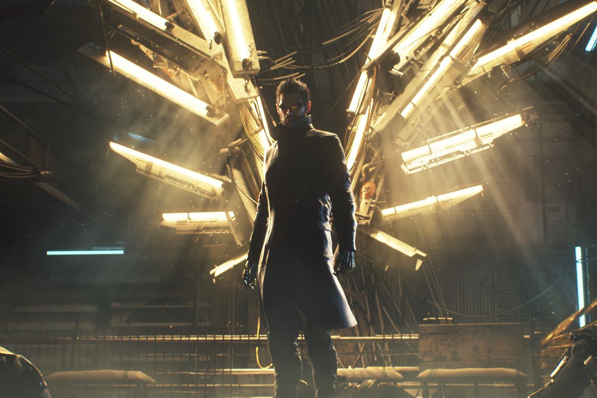 Deus Ex: Mankind Divided’s hero stands in front of lights, looking like an angel