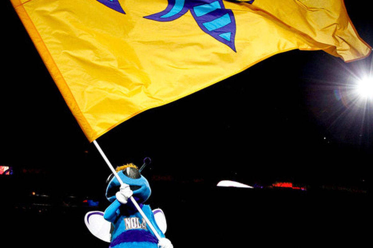 April 13, 2012; New Orleans, LA, USA; New Orleans Hornets mascot Hugo waves a flag before tip off of a game against the Utah Jazz at the New Orleans Arena.   Mandatory Credit: Derick E. Hingle-US PRESSWIRE