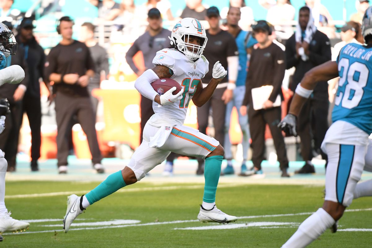 Jaylen Waddle #17 of the Miami Dolphins runs the ball after a catch during the second quarter against the Carolina Panthers at Hard Rock Stadium on November 28, 2021 in Miami Gardens, Florida.