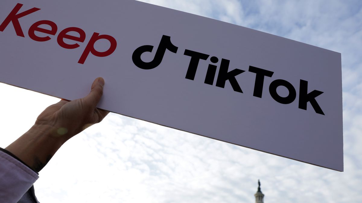 Rep. Bowman Is Joined By TikTok Users To Speak Out Against Banning The App. A photo of a person holding a sign outside congress that says: “Keep TikTok.”