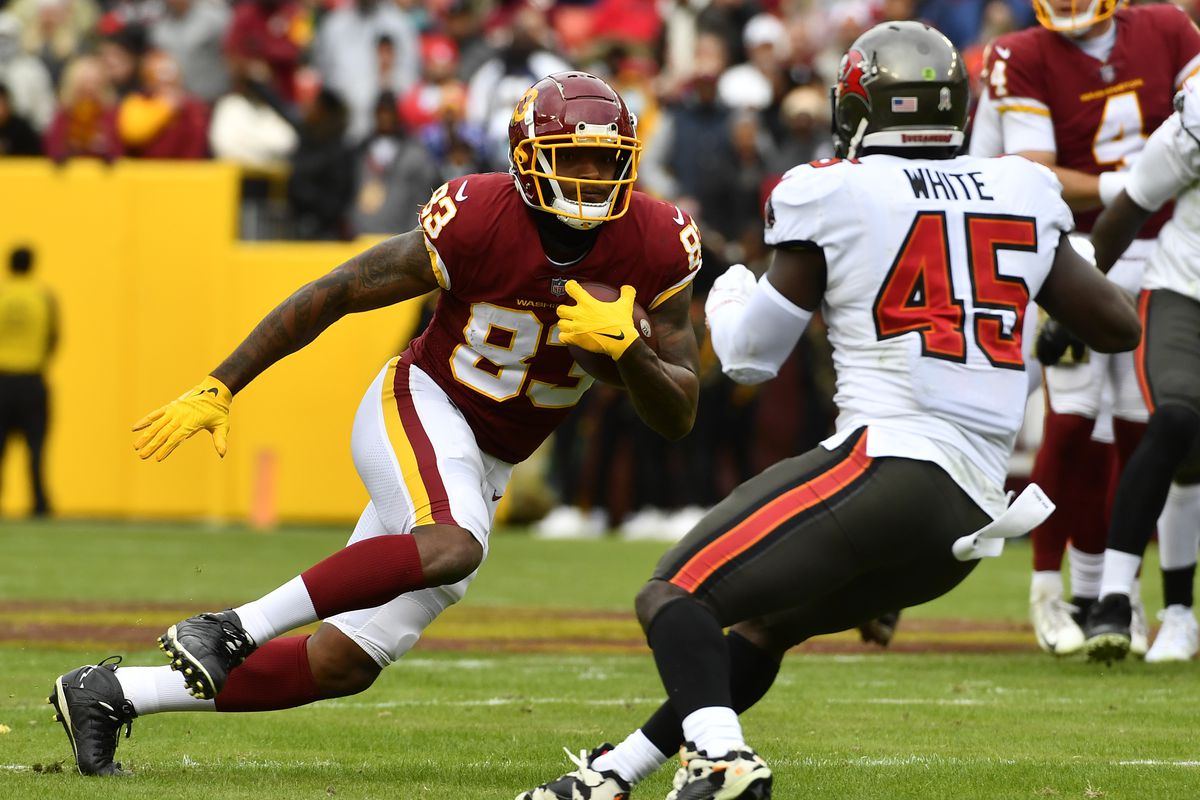 Washington Football Team tight end Ricky Seals-Jones (83) runs after a catch as Tampa Bay Buccaneers linebacker Devin White (45) defends during the first half at FedExField.
