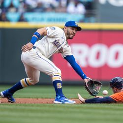 Second baseman Jose Caballero #76 of the Seattle Mariners tags out Kyle Tucker #30 of the Houston Astros, who was trying to steal second base during the second inning of a game at T-Mobile Park on May 7, 2023 in Seattle, Washington.