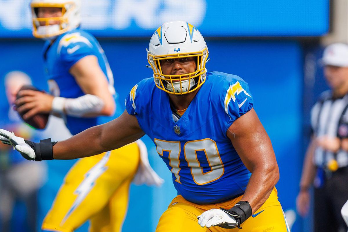 Los Angeles Chargers left tackle Rashawn Slater protects quarterback Justin Herbert during an NFL game.