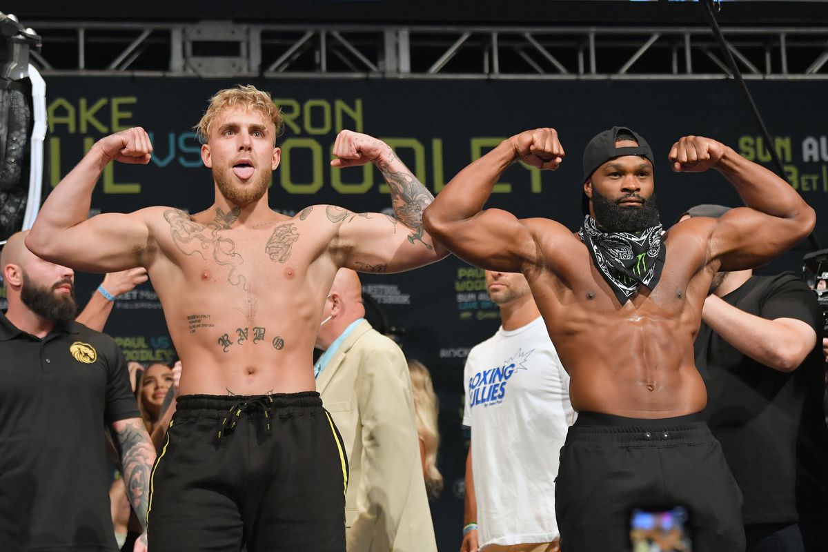 Jake Paul and Tyron Woodley pose during the weigh in event at the State Theater prior to their August 29 fight on August 28, 2021 in Cleveland, Ohio.