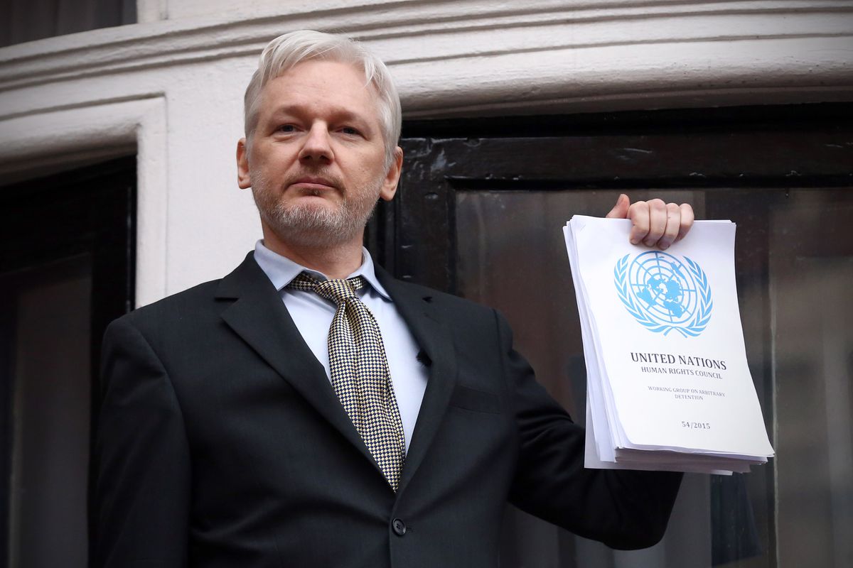 WikiLeaks founder Julian Assange speaks from the balcony of the Ecuadorian embassy where he continues to seek asylum following an extradition request from Sweden in 2012, on February 5, 2016, in London, England.