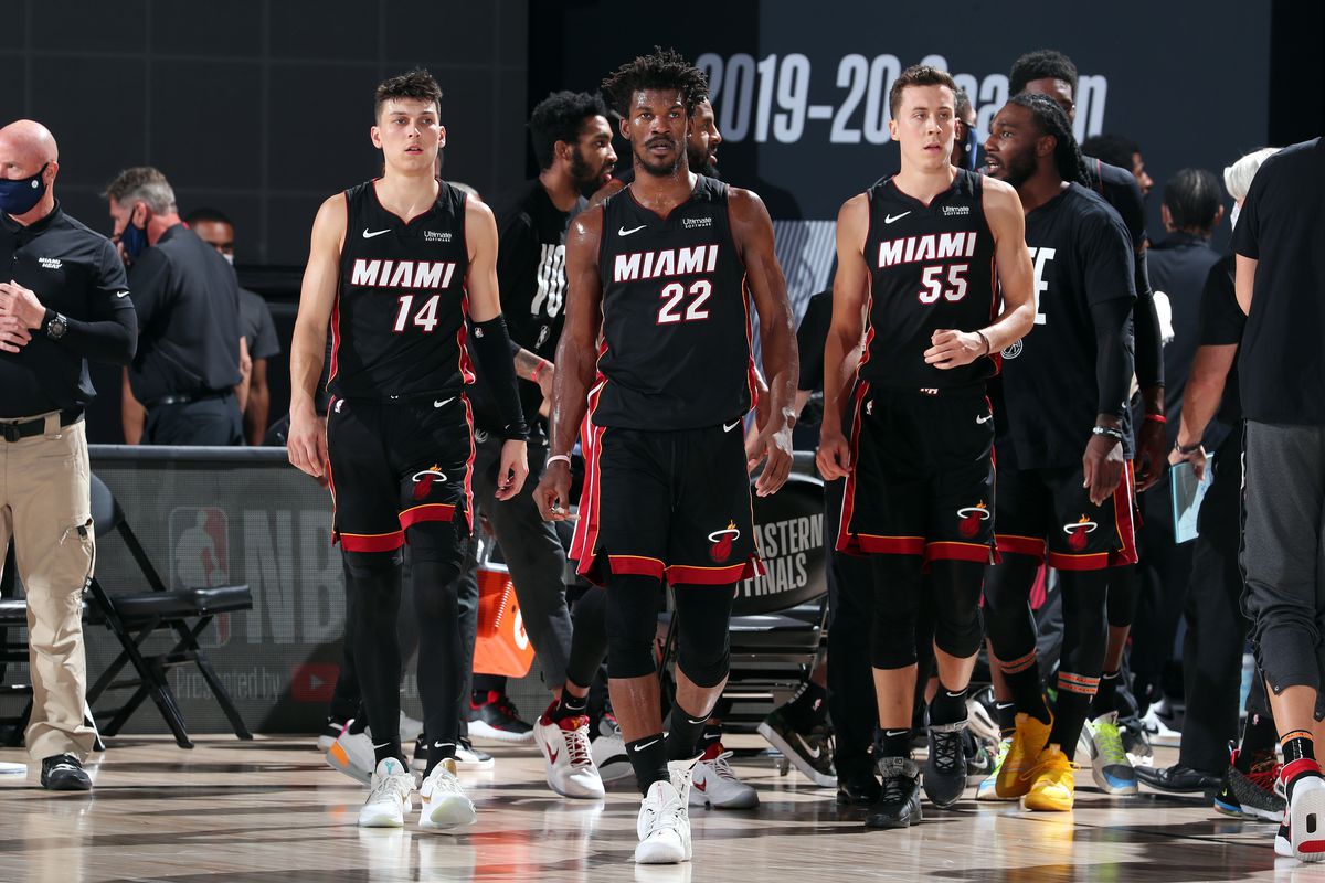 Tyler Herro of the Miami Heat, Jimmy Butler of the Miami Heat and Duncan Robinson of the Miami Heat look on during the game against the Boston Celtics during Game Six of the Eastern Conference Finals of the NBA Playoffs on September 26, 2020 at The AdventHealth Arena at ESPN Wide World Of Sports Complex in Orlando, Florida.