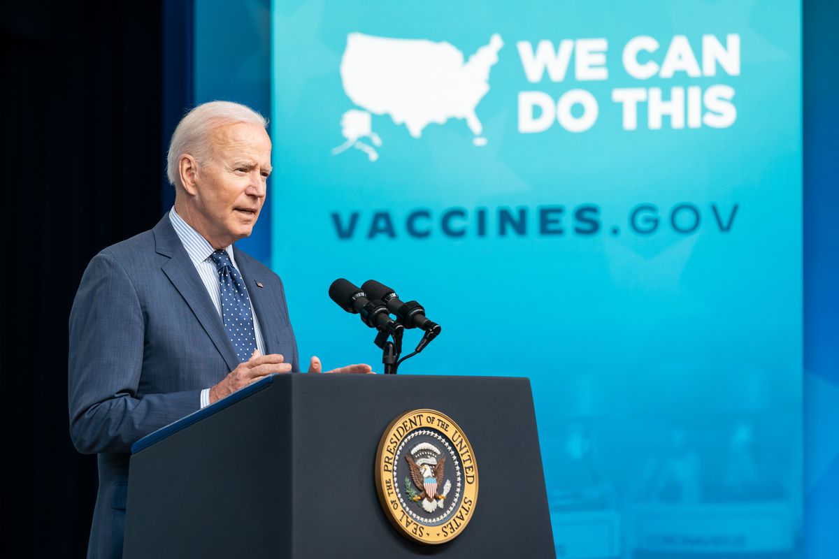 President Joe Biden speaks in front of a banner promoting Vaccines.gov with the slogan “WE CAN DO THIS”