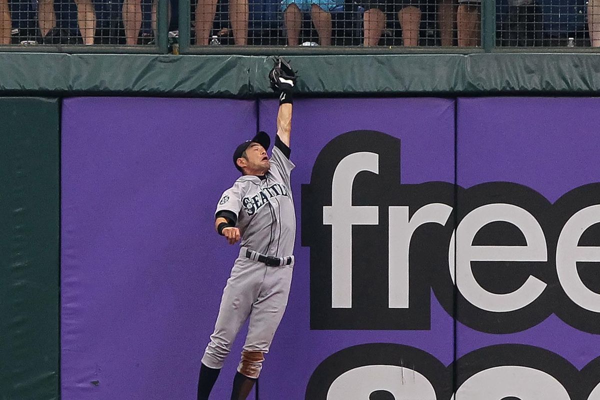 July 22, 2012; St. Petersburg, FL, USA; Seattle Mariners right fielder Ichiro Suzuki (51) catches a fly ball in the first inning against the Tampa Bay Rays at Tropicana Field. Mandatory Credit: Kim Klement-US PRESSWIRE