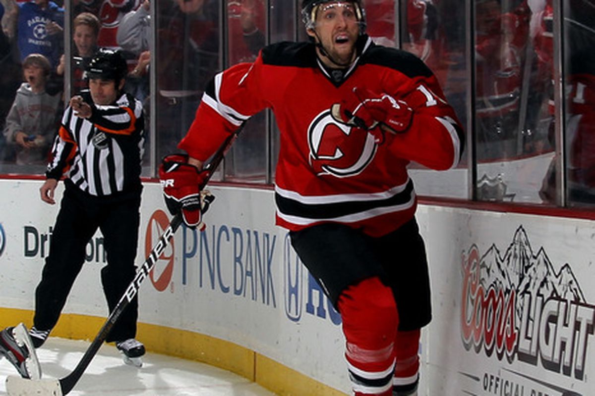 OK, his facial expression is pretty goofy looking.  Forgive him, he just scored in overtime to win Game 6 for the Devils against Florida. (Photo by Bruce Bennett/Getty Images)