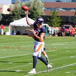 Quarterback Paxton Lynch attempts a pass during drills at Broncos camp.