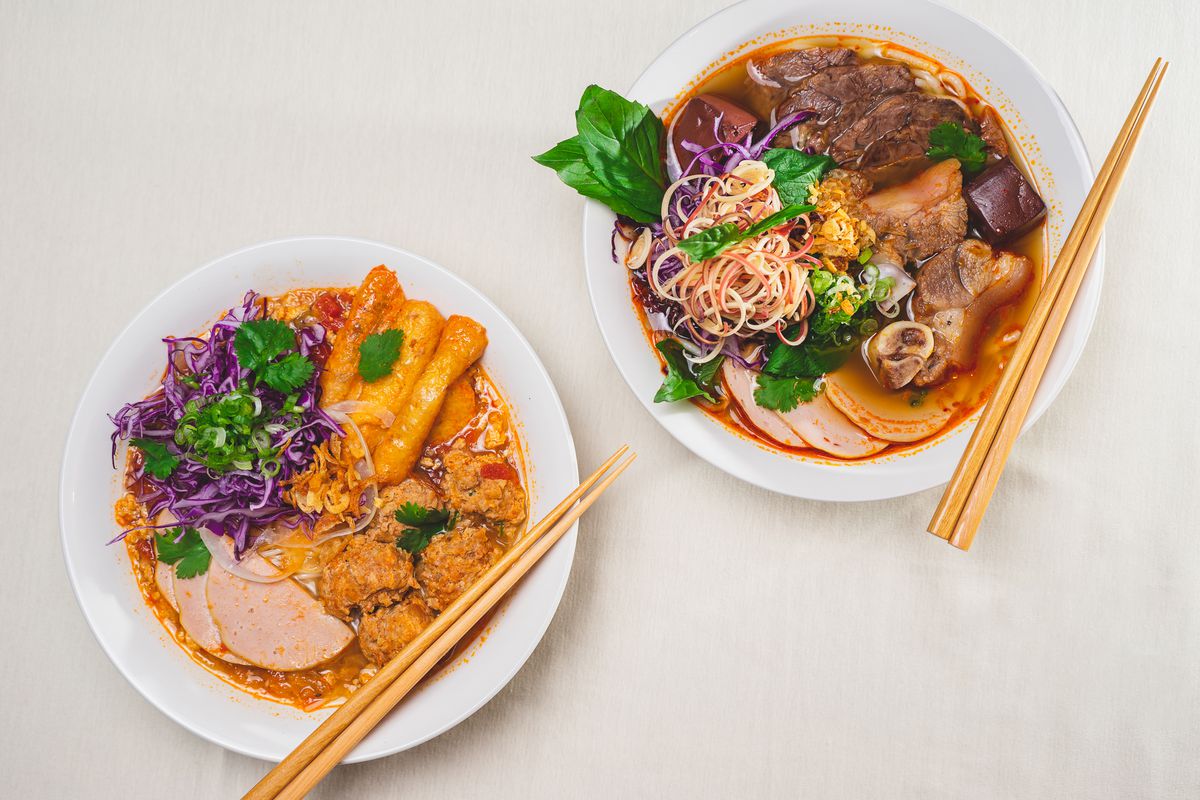 A bowl of bun rieu (left) and one of bun bo Hue