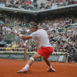 Spain's Rafael Nadal returns against compatriot David Ferrer in the final of the French Open tennis tournament, at Roland Garros stadium in Paris, Sunday June 9, 2013. 